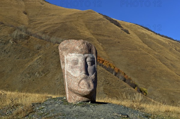 Stone sculpture of a male head, open-air exhibition Stone Heads of Sno by sculptor Merab