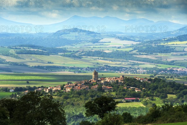 Village of Montpeyroux labelled Les Plus Beaux Villages de France and view on Sancy massif, Puy de