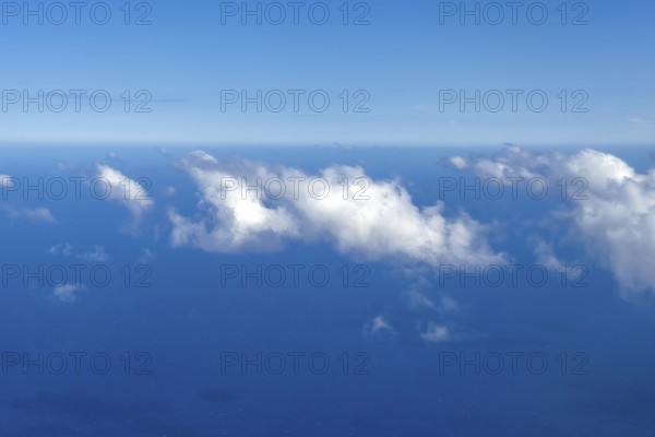 Aerial view from 11000 metres 36, 000 ft feet altitude on white cirrocumulus high cumulus clouds,