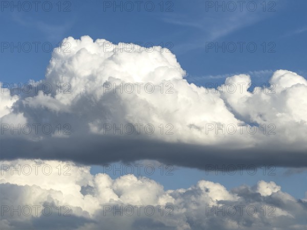Stratocumulus in the centre of the picture, dense cloud cover from many cumulus clouds in the