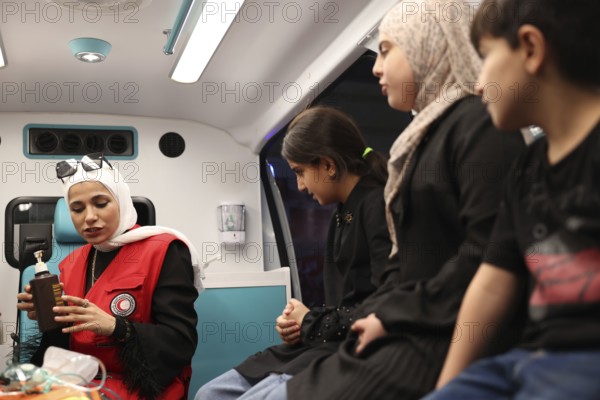 Syrian Arab Red Crescent volunteers conduct first aid training for children during the Damascus