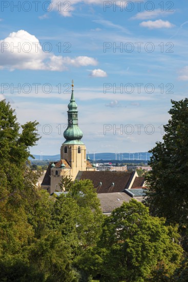 Church tower of St Stephan in Baden in front of a blue sky with clouds, Baden, Lower Austria,