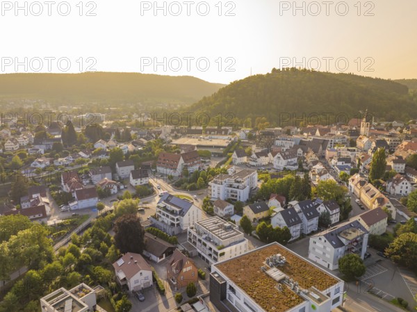 Idyllic town view at sunset with green hills and houses, small town pearl Nagold, Black Forest,