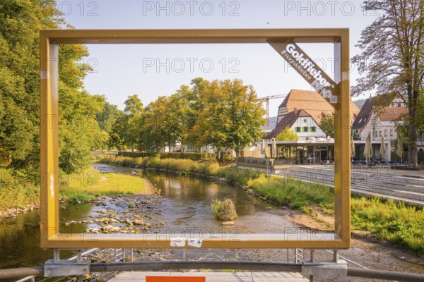 A river, framed by a large frame, in an urban landscape, small town pearl Nagold, Black Forest,