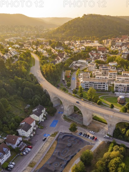 Bird's eye view of the town with viaduct and surrounding hills at sunset, small town Perle Nagold,
