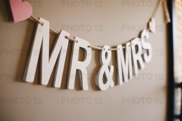 Close up of Mr & Mrs wedding garland with hearts. Romantic wedding decoration detail. Generative