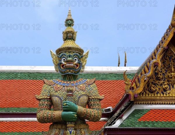 Colorful giant yaksha statue guarding the entrance of wat phra kaew, temple of the emerald buddha,