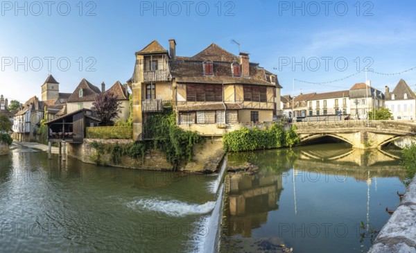 Picturesque view of the canal flowing through salies de bearn, a charming village located in the