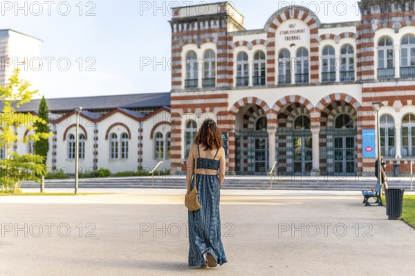Young woman visiting the famous thermal baths in salies de bearn, a popular spa town in the