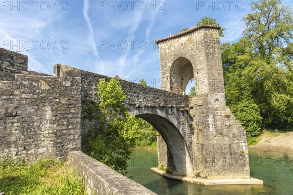 The historic stone bridge in sauveterre de bearn, france, stands majestically over the gave