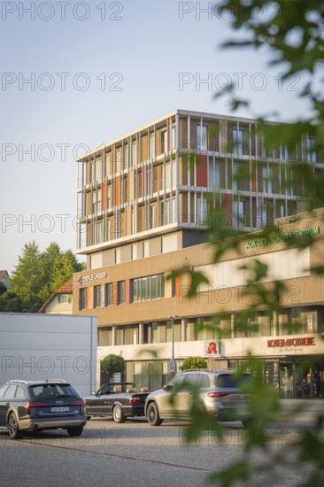 Office building on a street with cars and modern architecture, Nagold, district of Calw, Black