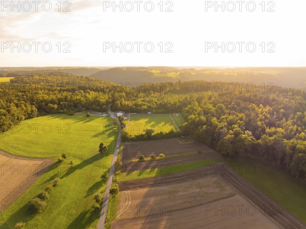 Wide landscape with shadow play over fields and forests at sunset, VFL Stammheim, Calw, Black