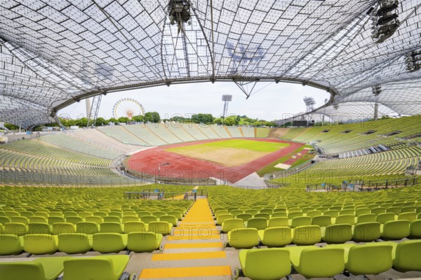 Panoramic view of a modern empty stadium with striking glass roof, Olympiapark, Munich, Germany