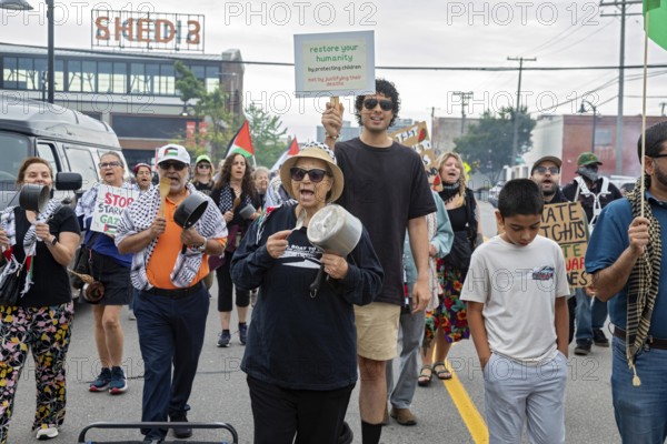 Detroit, Michigan USA - 23 August 2025 - Protesters rally at Eastern Market, banging empty pots to