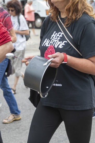 Detroit, Michigan USA - 23 August 2025 - Protesters rally at Eastern Market, banging empty pots to