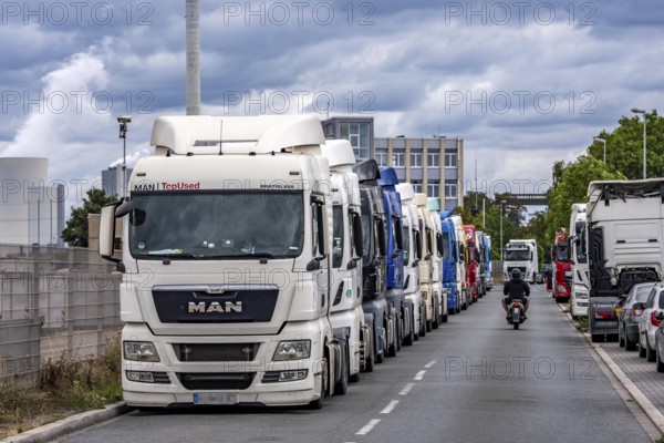 Truck tractors, exclusively from Eastern European countries, park in the harbour area, the canal