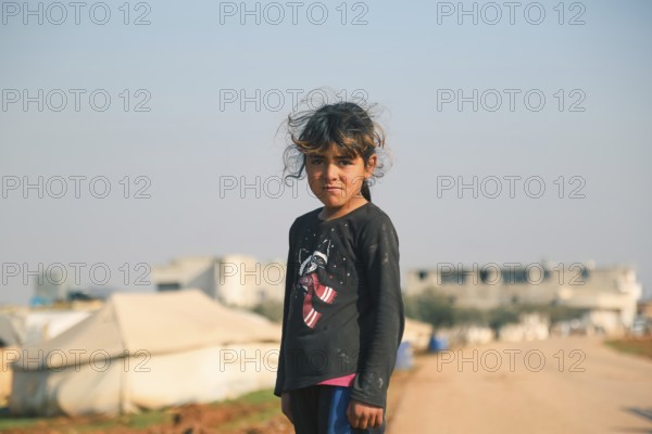 Syrian children living in a temporary refugee camp near the Syrian-Turkish border on World