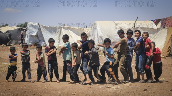 A group of Syrian refugee children gathered inside a camp. Aleppo, Syria February 1, 2015, Aleppo,