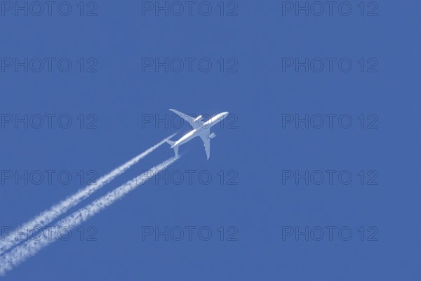 Boeing 787 Dreamliner jet passenger aircraft of KLM Royal Dutch airlines with a vapour trail or