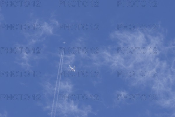 Two airliners Airbus A380 jet passenger aircraft of Emirates airlines and a Boeing 737 of Norweign