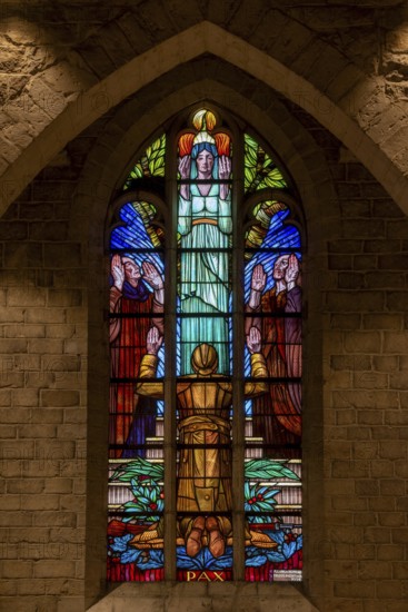 Stained glass window showing WWI Belgian soldier at World War One necropolis in the St Peter's