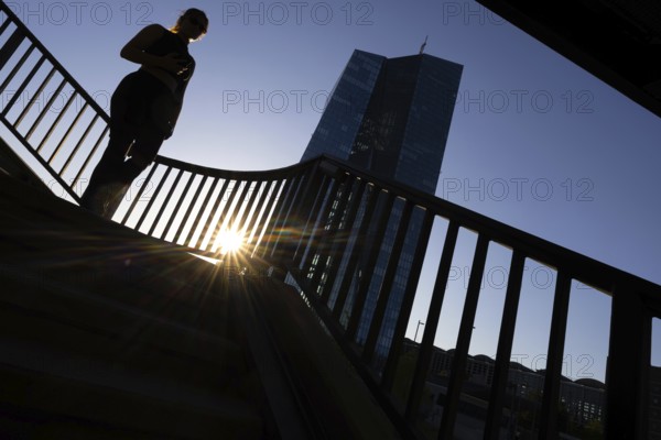The sun sets behind the European Central Bank (ECB) in Frankfurt am Main, Frankfurt am Main, Hesse,