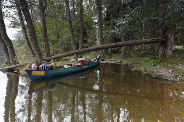 Canoe by nature photographers in Drosedower Bek, Müritz National Park, Mecklenburg-Western
