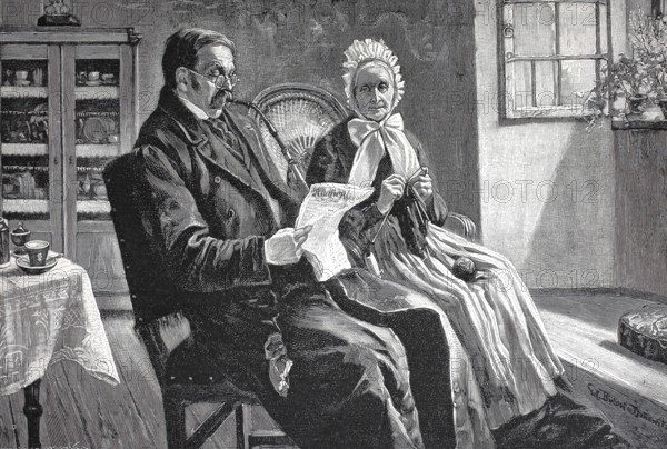 The latest news, man and woman sitting in the living room, he is reading the newspaper, she is