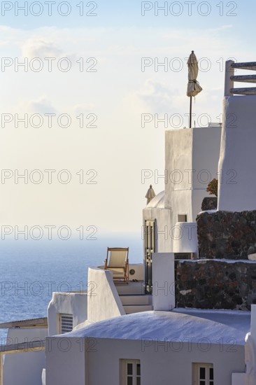 Sun lounger on terrace, holiday home with sea view, evening light, Oia, Thira, Santorini, Cyclades,