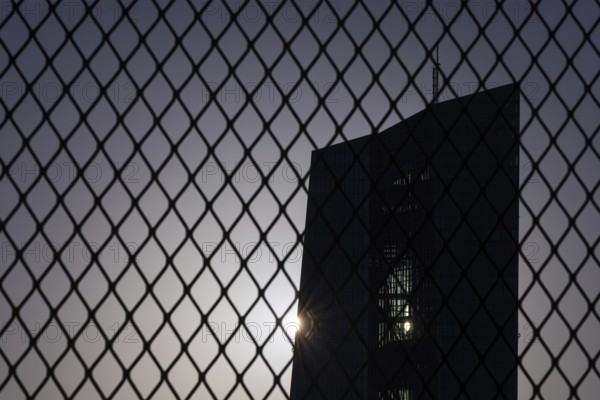 The sun passes behind the European Central Bank (ECB) in Frankfurt am Main, Frankfurt am Main,