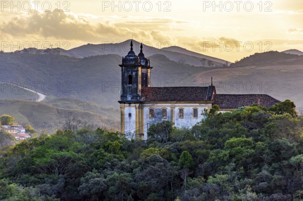 Mountains and baroque church at sunset in the historic city of Ouro Preto in Minas Gerais, Ouro