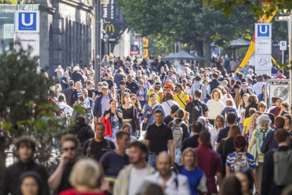 Crowd on the way in the shopping street. Königstraße pedestrian zone in Stuttgart,