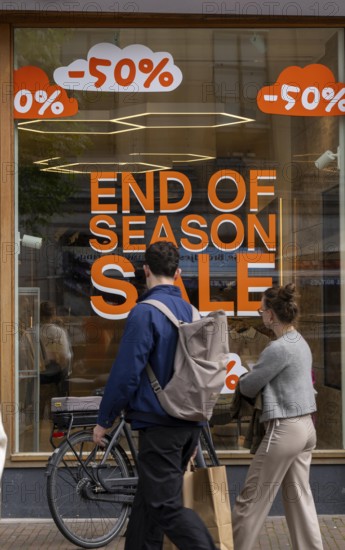 Fashion shop, boutique, with advertisement in the window for the end of season sale, summer sale,