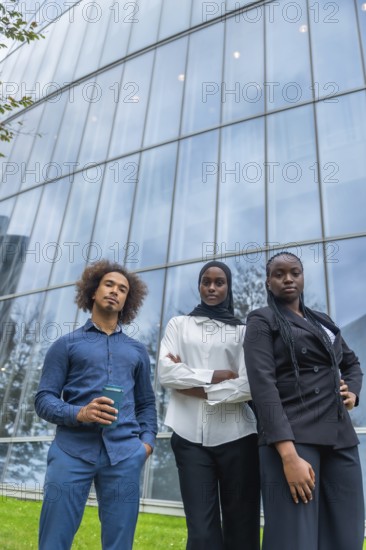Group of young diverse business professionals standing with confident serious expressions in front