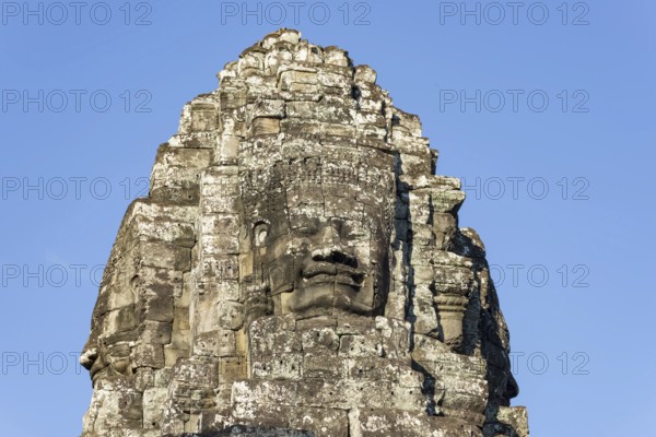 Huge stone-carved face of Bodhisattva Lokeshvara, also Avalokiteshvara, Bayon Temple, Angkor Thom,