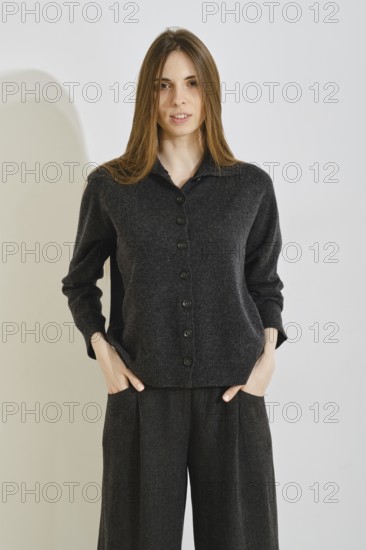 A stylish woman showcases a trendy outfit that prioritizes comfort and practicality