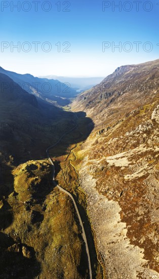 Autumn colours of Pen-y-Pass over Miner's Track, Start Point and road A4086 from a drone,