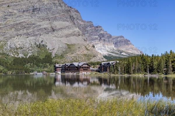 240831_319 Many Glacier Hotel at the bae of the mountains along the shoreline of Swiftcurrent Lake