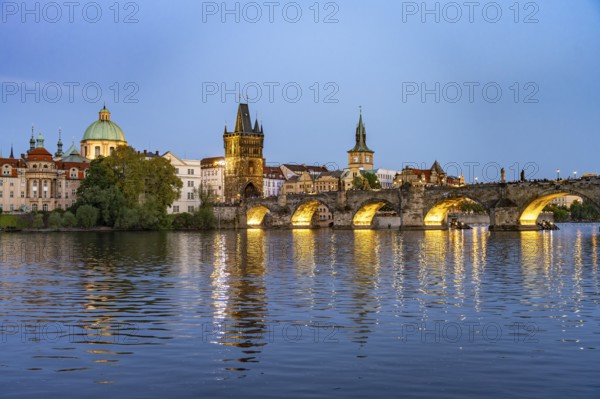 Old Town of Prague with Vltava River, Charles Bridge and Old Town Bridge Tower at dusk, Prague,
