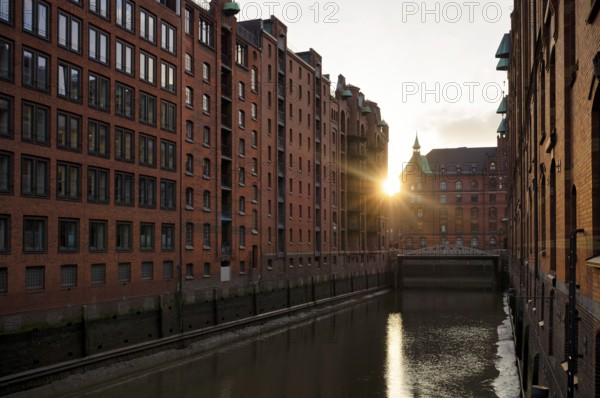 Warehouses, façade, brick building, Hamburger Speicherstadt, Hafencity, canal, sunset, evening