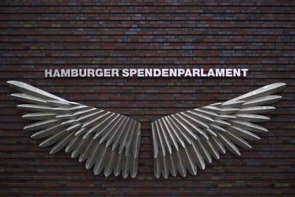 Exterior photo logo, wing, swing, Hamburg donation parliament, lettering, façade, warehouses, brick