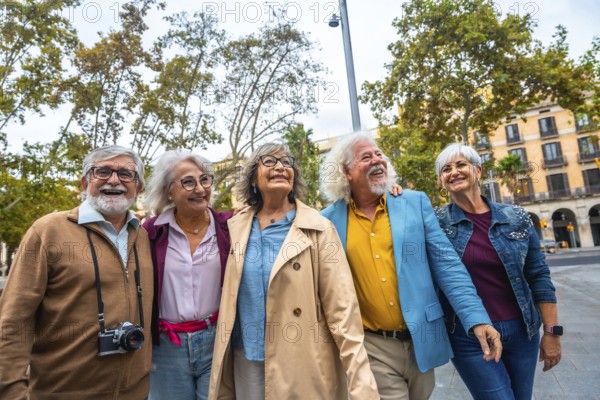 Group of smiling multi ethnic senior friends embracing, walking, and enjoying a sightseeing trip in