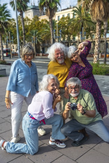 Cheerful group of senior friends traveling together, capturing fun memories with an analog camera