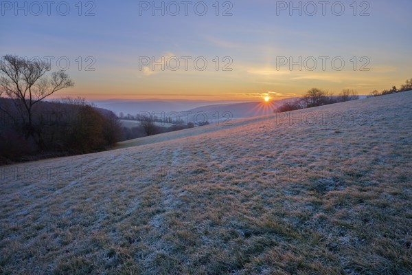A frosty morning with sunrise over a rolling landscape, Seckmauern, Lützelbach, Maintal, Odenwald,