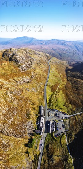 Autumn colours of Pen-y-Pass over Miner's Track, Start Point and road A4086 from a drone,