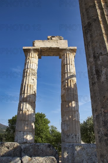 Single antique column with clear sky in the background. Greek Ruins, Nemea, Ancient Zeus Heightum,