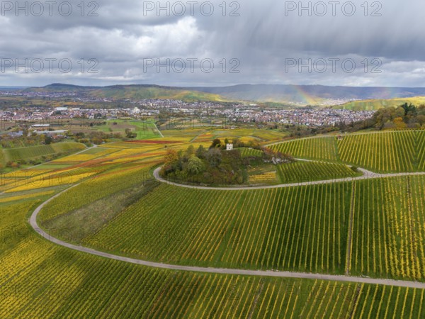 Wide landscape with vineyards and a rainbow under a cloudy sky, autumn, Schützenhüttle-Donkey, near