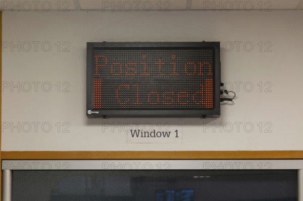 Position Closed sign at railway ticket office, Exeter St Davids railway station, Exeter, Devon,