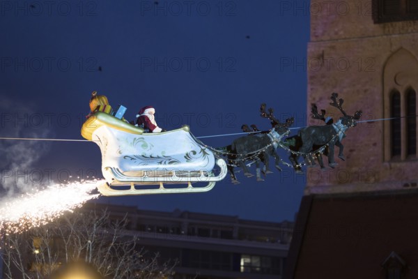 Santa Claus floats in a carriage at the opening of the Berlin Christmas market on Alexanderplatz,