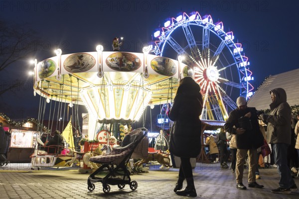 Children's carousel and Ferris wheel at the Berlin Christmas market on Alexanderplatz, Berlin, 24